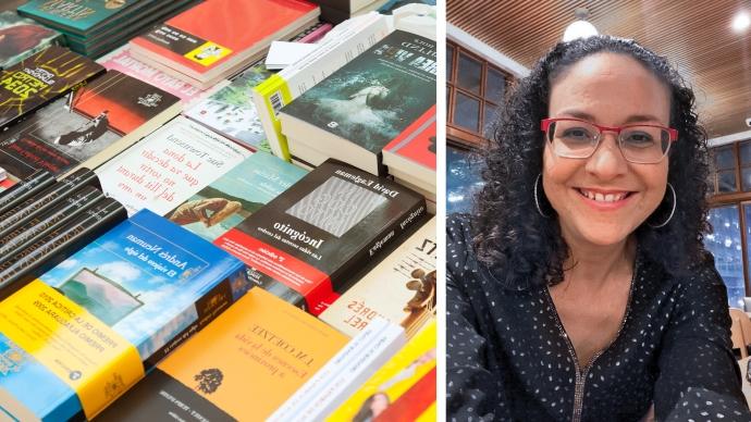 Dania Abreu-Torres portrait next to stack of books